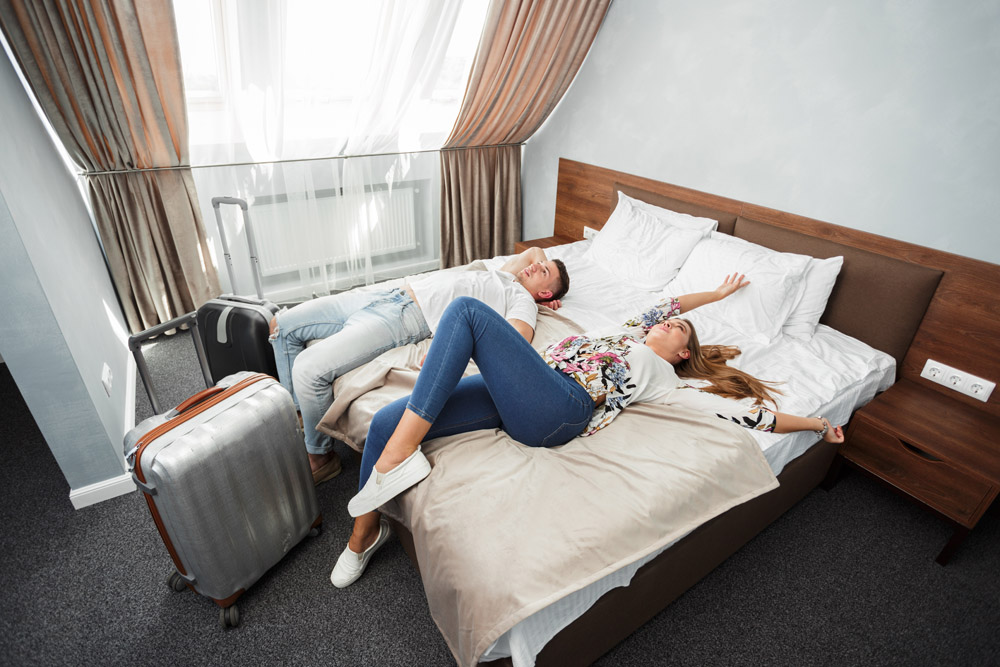 Young couple travel together hotel room leisure