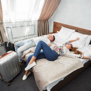 Young couple travel together hotel room leisure